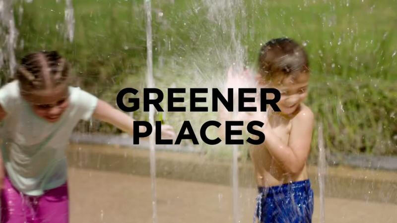 An image of children having fun with water in a park